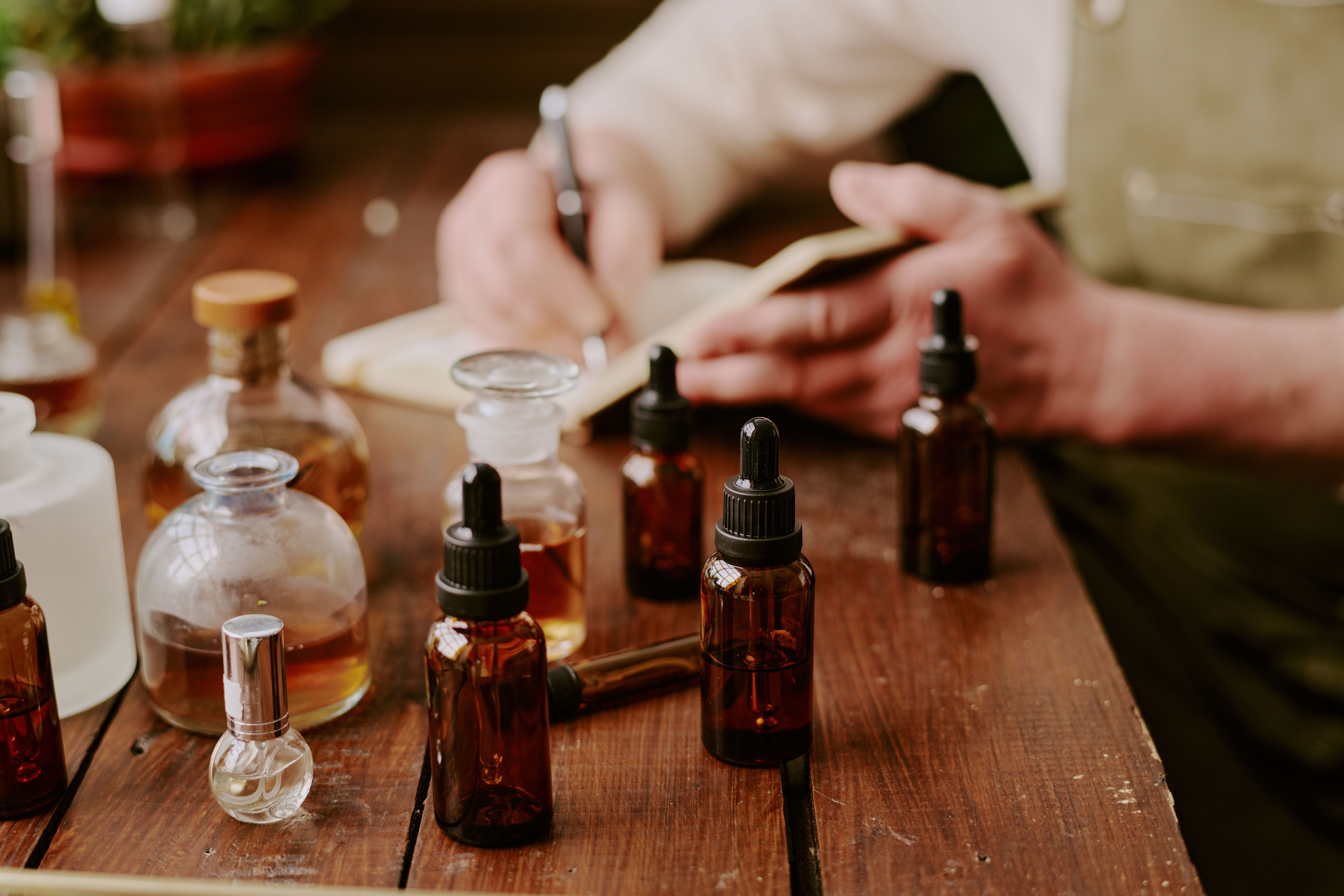 An array of serums using amber boston rounds and droppers on a table